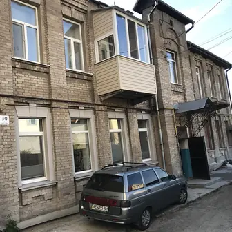 A multi-storey apartment block seen from the street